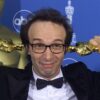 Roberto Benigni celebrates the two Oscars he won in 1999, for Best Actor and Best Foreign Language Film for 'Life is Beautiful'