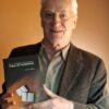 Architect and writer Airton Cattani with his book "The (Almost) True Diaries of an Immigrant Couple," which will be launched in Garibaldi (RS) on August 1, 2026. Photo: Press Release